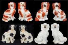 Four pairs of 19th century and later Staffordshire pottery dogs,