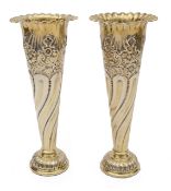 A pair of Edwardian silver-gilt spill vases