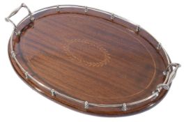 Tiffany & Co. A silver galleried oval mahogany drinks tray