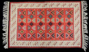 A Turkish red ground Kelim rug