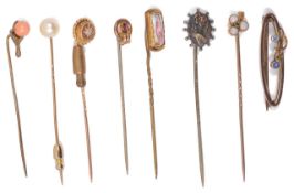 A Victorian opal set trefoil stick pin and a collection of other stick pins