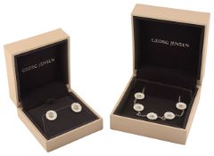 A Georg Jensen silver and enamel daisy bracelet and matching earrings