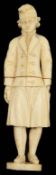An early 19th c. Dieppe ivory needle case carved in the form of a fisherman,
