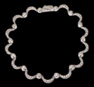 A delicate white gold and diamond set bracelet