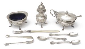 An Edwardian silver three piece cruet set and other silver items