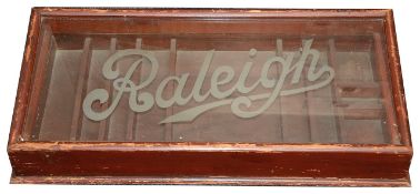 A vintage Raleigh Cycles wooden display cabinet,