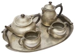A Liberty & Co 'Tudric' hammered pewter five piece tea service Attrib. to Archibald Knox c.1905