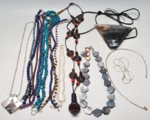FIFTEEN CONTEMPORARY BEADED AND SILVER NECKLACES