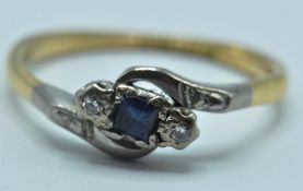 ANTIQUE 18CT GOLD AND SAPPHIRE CROSS OVER RING