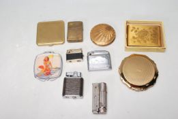 COLLECTION OF VINTAGE LIGHTERS AND RETRO POWDER COMPACTS