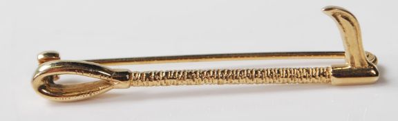 9CT GOLD HORSE RIDING CROP BROOCH