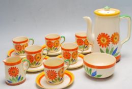 FIFTEEN PIECE ART DECO 1930’S TEA SET DECORATED WITH ORANGE FLOWERS