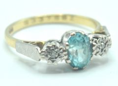 18CT GOLD BLUE STONE & DIAMOND RING