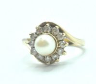 9CT GOLD PEARL AND WHITE STONE CROSSOVER RING