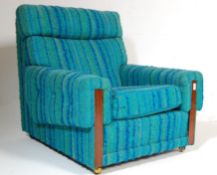 A retro mid century teak wood and upholstered easy chair / armchair