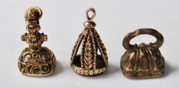 THREE ANTIQUE FOB SEALS INCLUDING A 9CT GOLD EXAMPLE