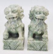 TWO 20TH CENTURY GREEN HARDSTONE FU DOGS / TEMPLE LIONS