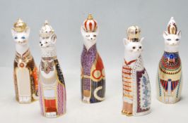FIVE ROYAL CROWN DERBY FIGURINES FROM THE 'ROYAL CATS' SERIES; ABYSSINIAN, BURMESE, EQGYPTIAN ETC.