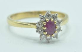 18CT GOLD RUBY AND DIAMOND CLUSTER RING