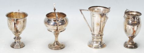 COLLECTION OF FOUR HALLMARKED STERLING SILVER MINIATURE TROPHIES
