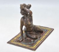 20TH CENTURY VIENNA BRONZE FIGURINE OF A LADY ON A RUG