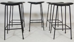FIVE RETRO BLACK BAR STOOLS IN BLACK LEATHER AND TUBULAR METAL.