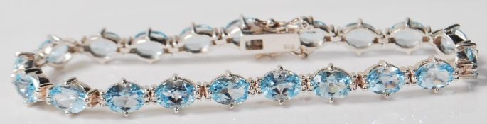 CONTEMPORARY SILEVR AND BLUE STONE TENNIS BRACELET