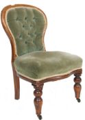A 19TH CENTURY VICTORIAN WALNUT NURSING CHAIR