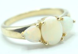 9CT GOLD AND OPAL THREE STONE RING