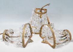 A SET OF THREE 20TH CENTURY ANTIQUE EMPIRE STYLE BRASS AND CRYSTAL WALL LIGHTS