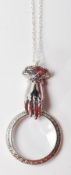 SILVER MAGNIFYING GLASS PENDANT