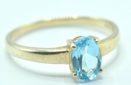 9CT GOLD AND BLUE STONE SOLITAIRE RING