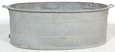 A RETRO 20TH CENTURY RECLAMATION YARD GALVANISED BATH