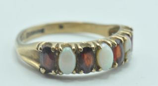 9CT GOLD RUBY AND OPAL CABOCHON 7 STONE RING