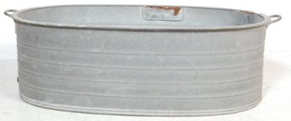 A RETRO 20TH CENTURY RECLAMATION YARD GALVANISED BATH