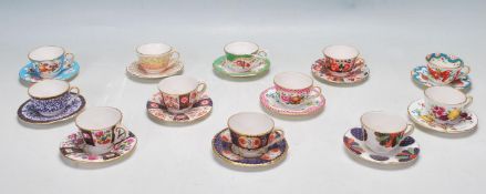 TWELVE ROYAL WORCESTER MINIATURE TEA CUPS AND SAUCERS