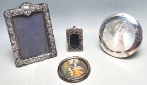 FOUR HALLMARKED STERLING SILVER PHOTOFRAMES