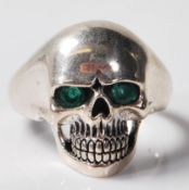 SILVER SULL RING SET WITH GREEN STONE EYES