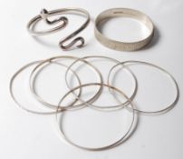 SEVEN VINTAGE SILVER BANGLE BRACELETS