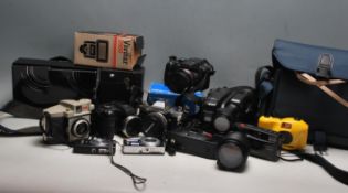 A large collection of vintage camera equipment to include a Kodak box brownie, Sony Ericcson cyber