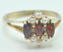 9CT GOLD MARQUISE CUT GARNET AND PEARL RING