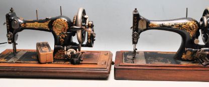 TWO EARLY 20TH CENTURY CASED SEWING MACHINES SINGER AND JONES