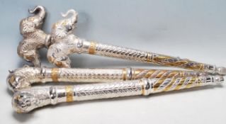 COLLECTION OF TRIBAL STYLE METAL CEREMONIAL STAFF ENDS