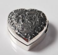 STERLING SILVER PILL BOX DECORATED WITH A COURTING COUPLE