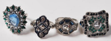 GROUP OF FOUR ART DECO STYLE DRESS RINGS