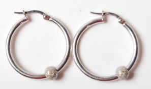 9CT WHITE GOLD HOOP EARRINGS WITH SLIDING GLITTER BALL DECORATION