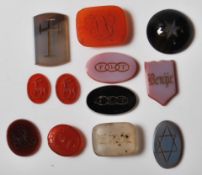 TWELVE ANTIQUE CARVED STONE INTAGLIOS