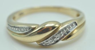 9CT GOLD AND DIAMOND LADIES CROSSOVER RING