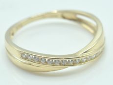 9CT GOLD AND WHITE STONE CROSSOVER HALF ETERNITY RING