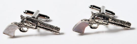 PAIR OF STERLING SILVER CUFFLINKS IN THE FORM OF PISTOLS WITH MOTHER OF PEARL HANDLES